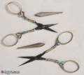 Pair of Unmatched Scissors and Sheaths